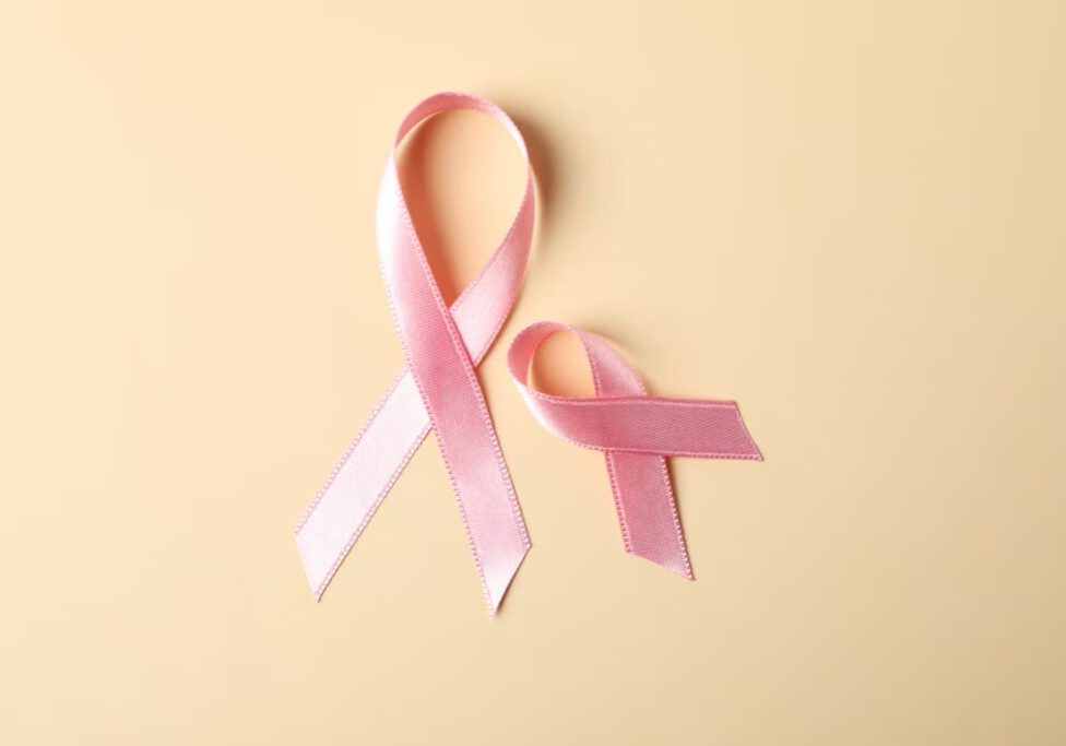 6704f8c81d054d3146e38471_pink-awareness-ribbons-on-color-background-space-2023-11-27-05-11-30-utc (1)